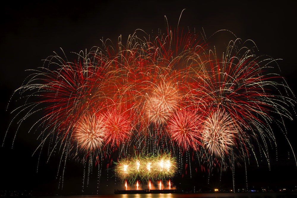 a large fireworks display over a body of water