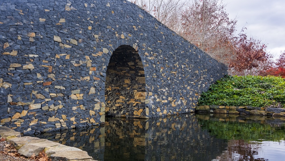 a stone bridge over a body of water