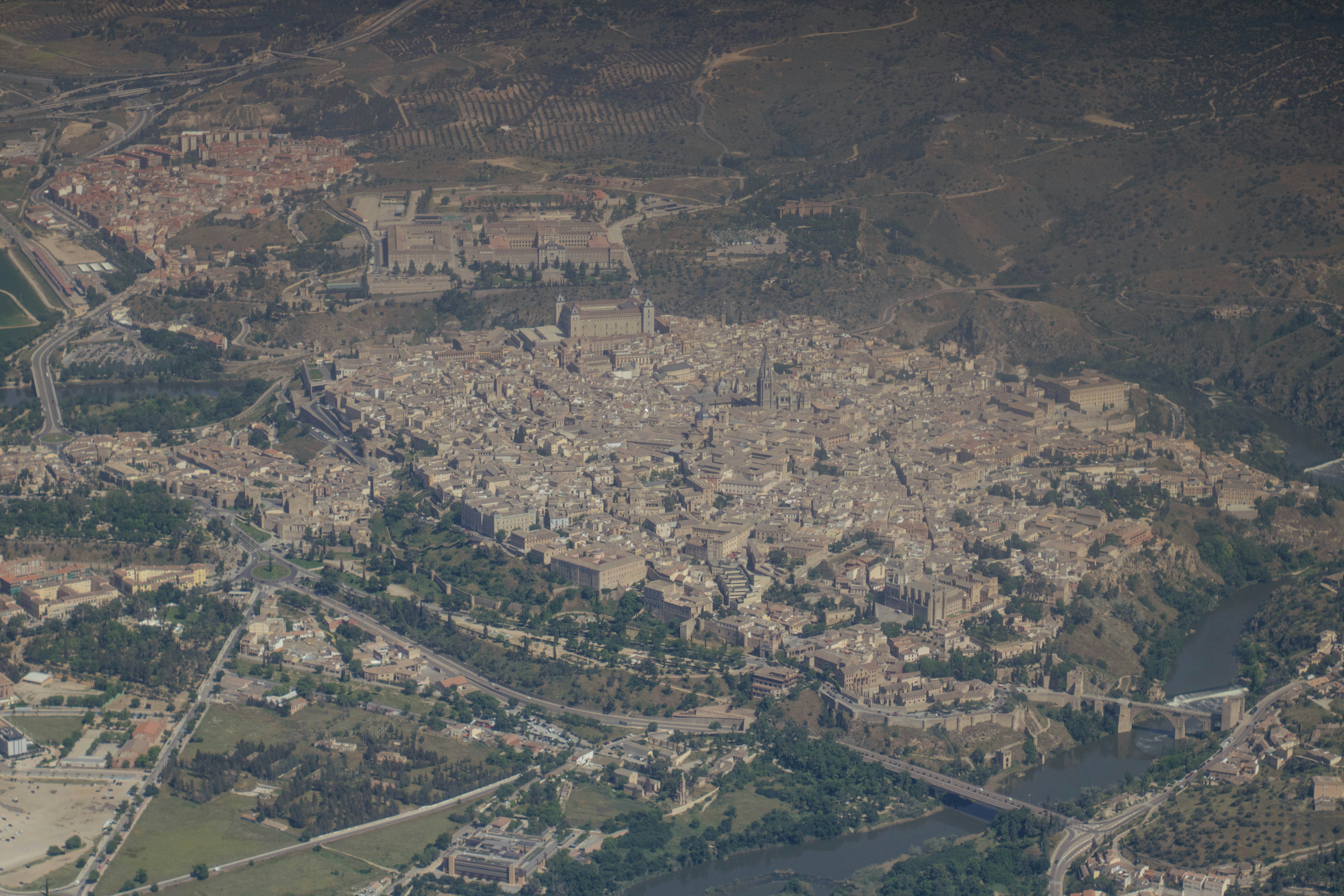 an aerial view of a city with a river running through it
