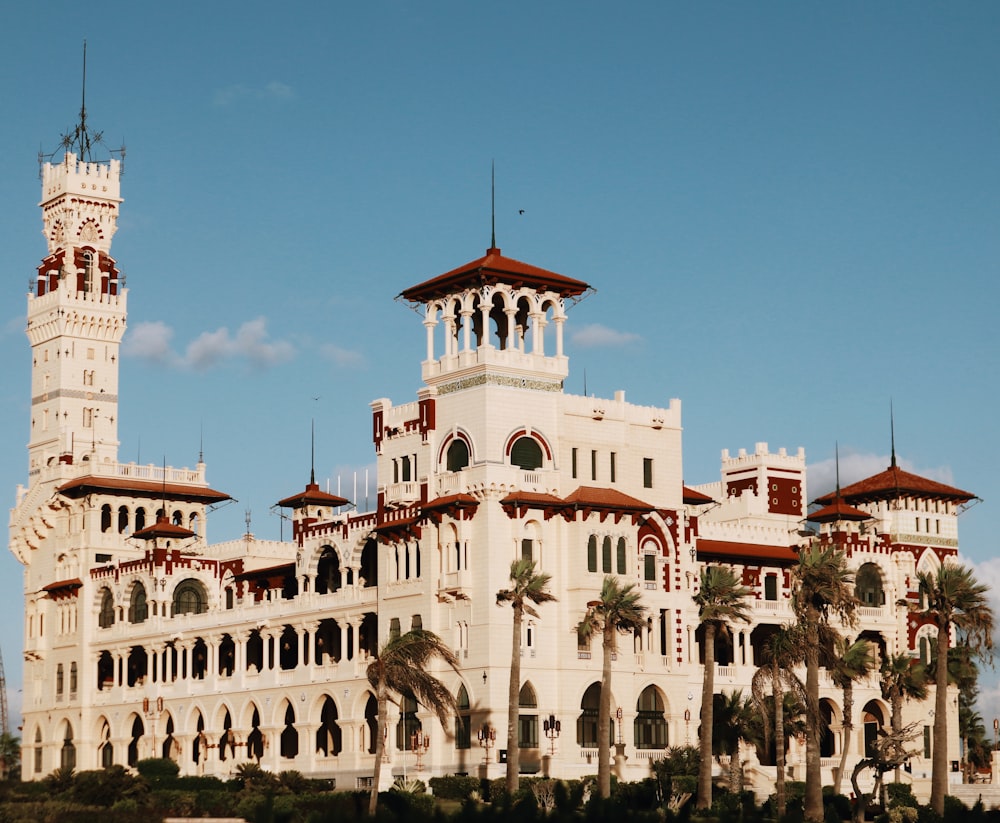 a large white building with a clock tower