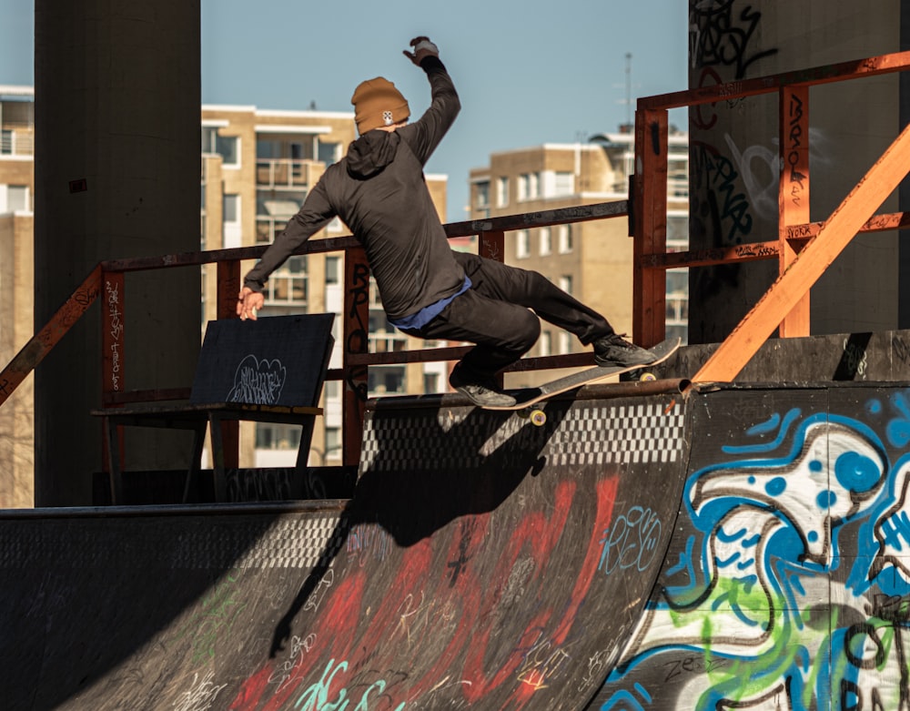 a man riding a skateboard up the side of a ramp