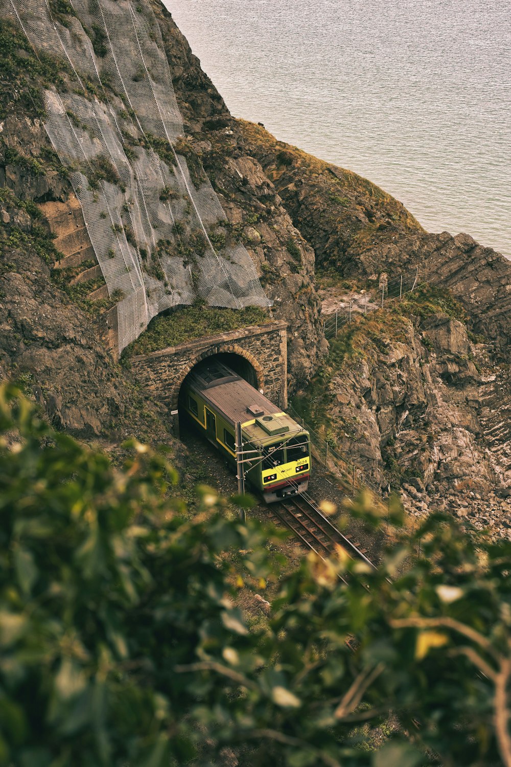 a train is coming out of a tunnel