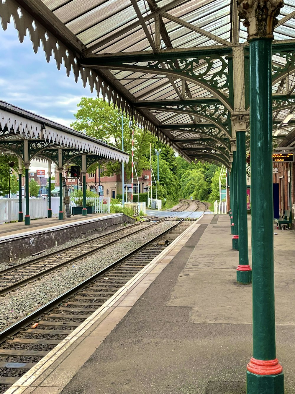 a train station with a train on the tracks