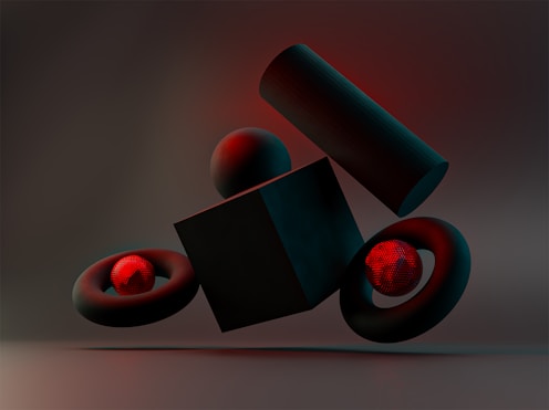 a black object with a red light coming out of it