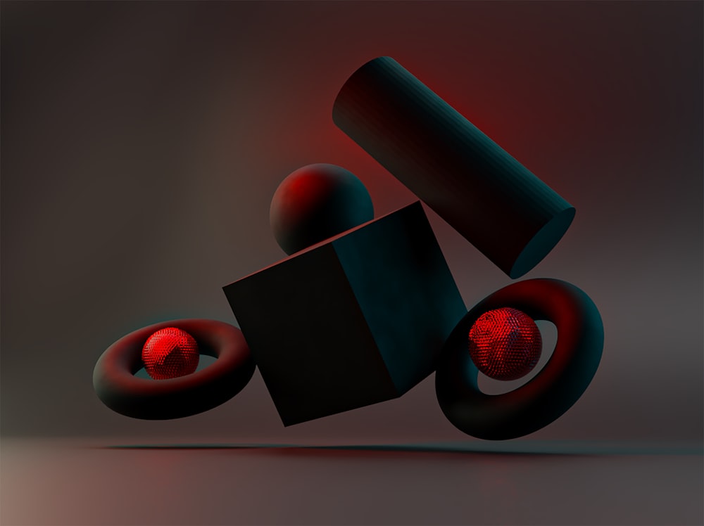 a black object with a red light coming out of it