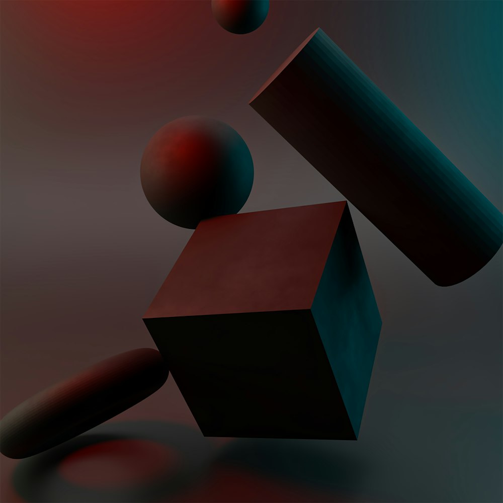 a black object with a red object in the background