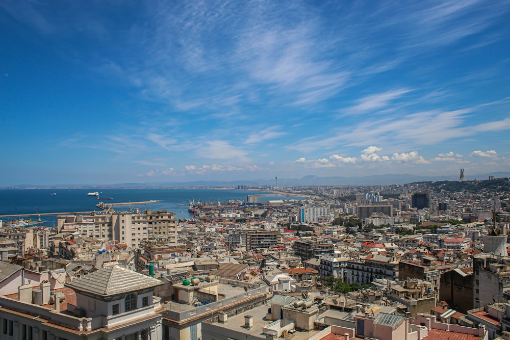 a view of a city with a body of water in the distance