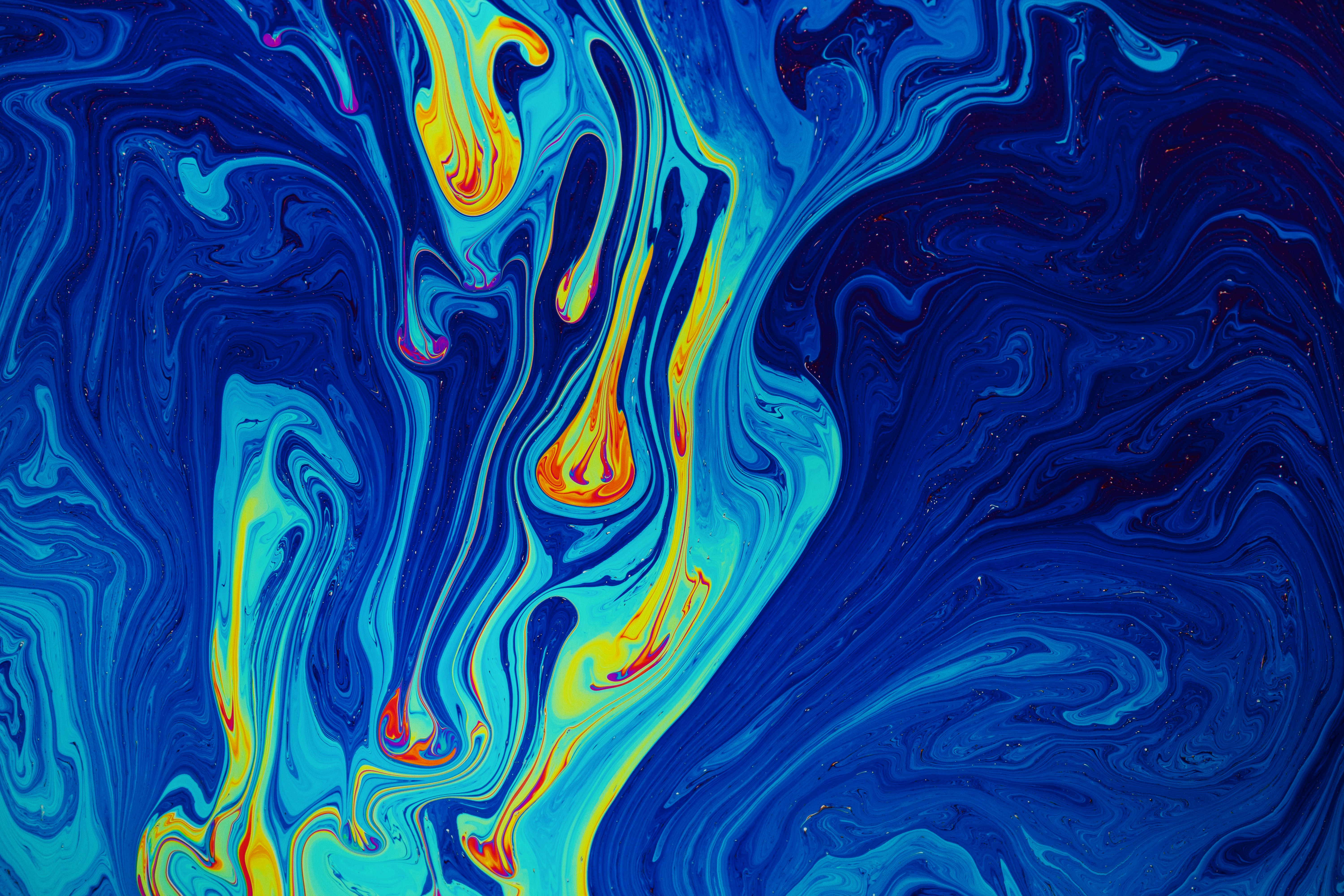 a painting of blue and yellow swirls on a blue background