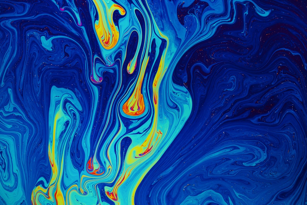 a painting of blue and yellow swirls on a blue background