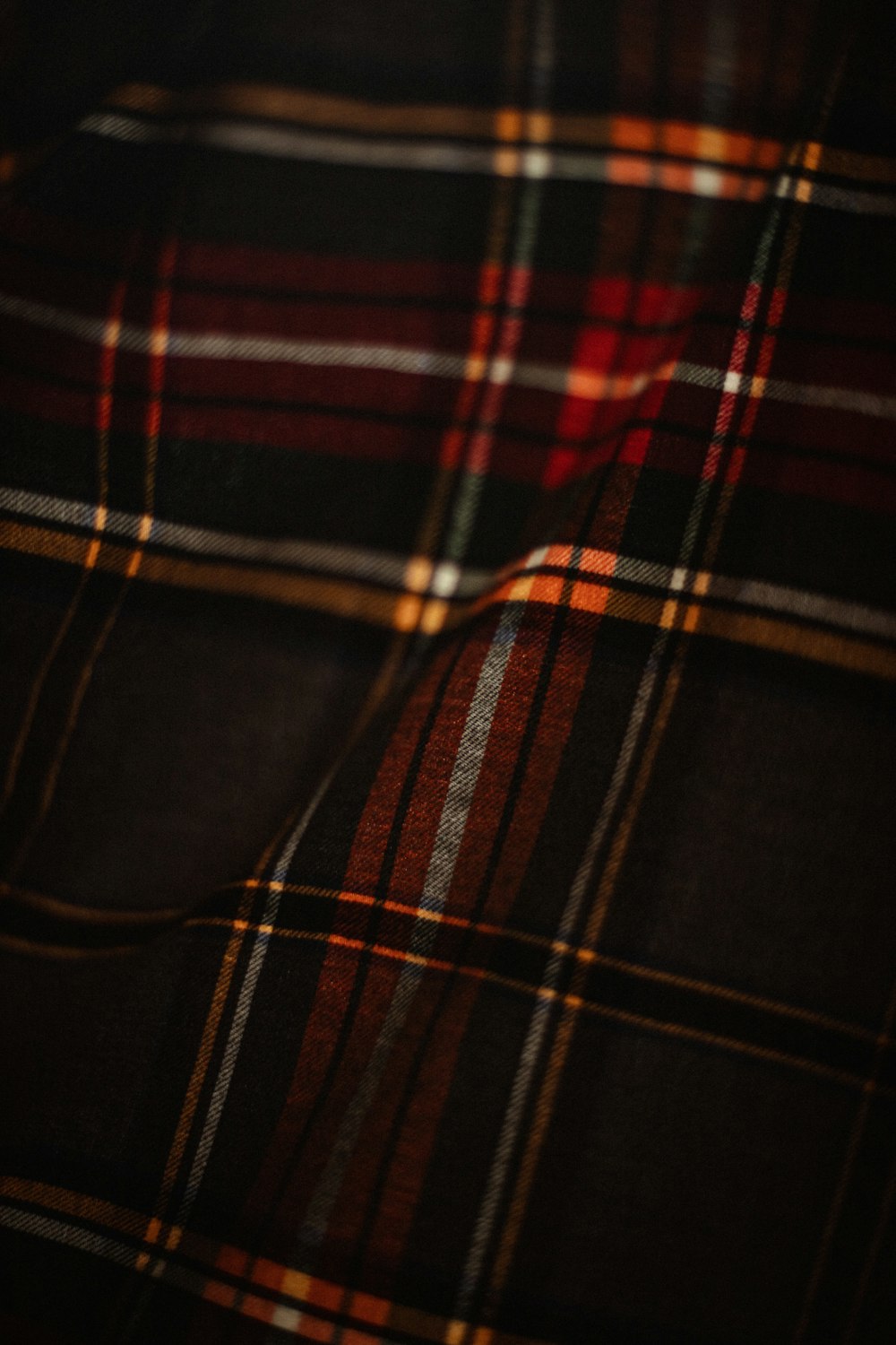 a close up of a red and black plaid fabric