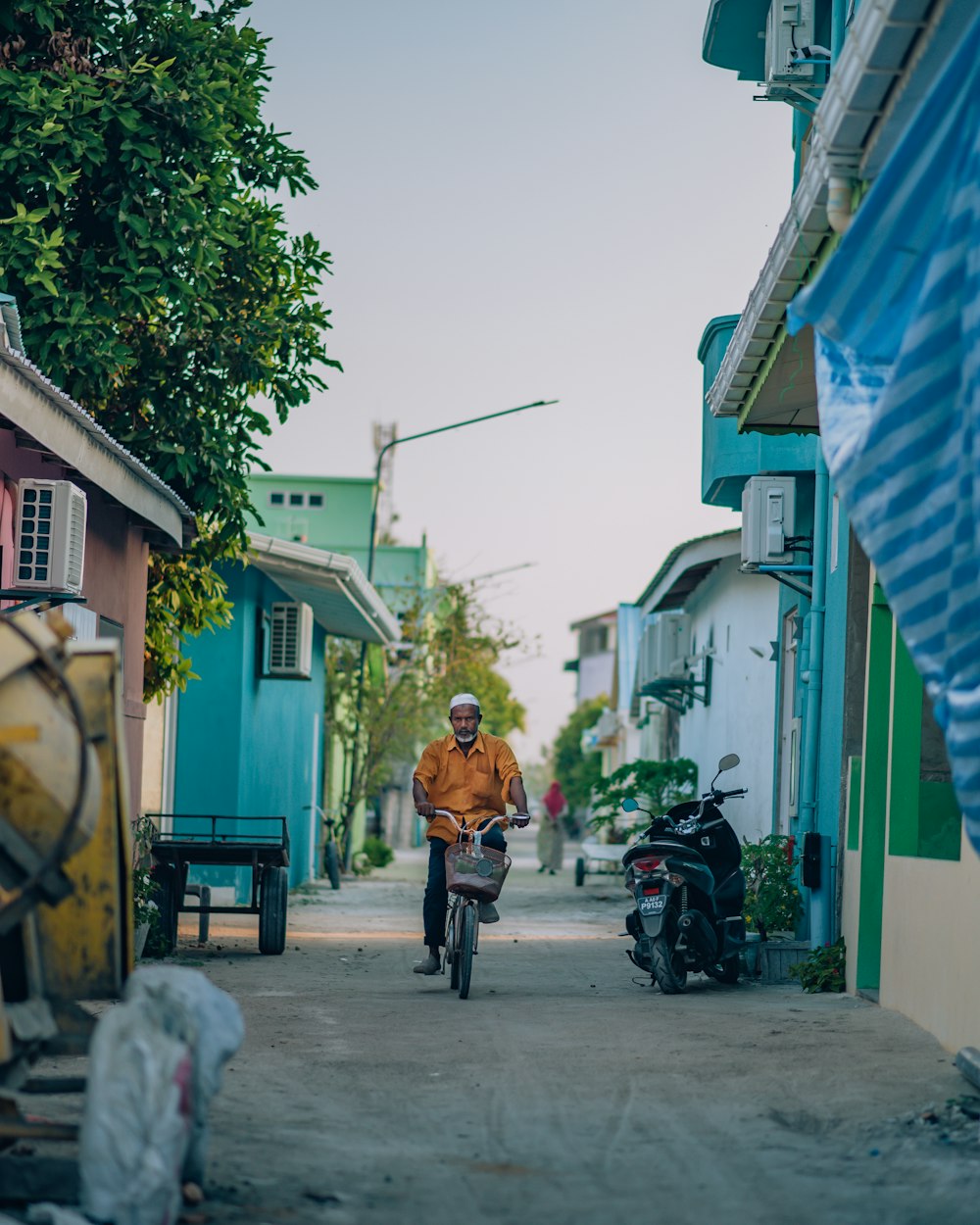 a man riding a bike down a street