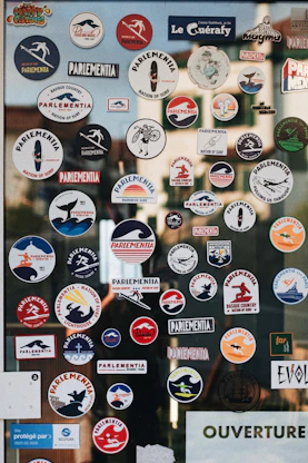 a bunch of stickers on a glass door