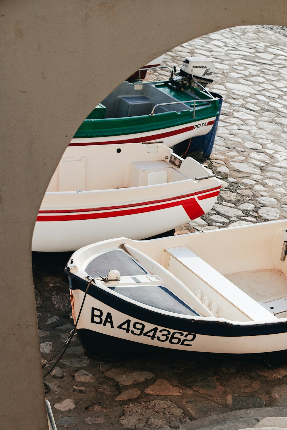 a couple of small boats sitting next to each other