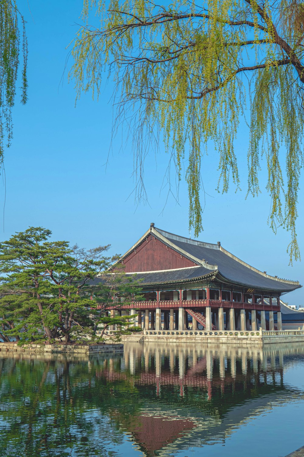 a large building sitting next to a body of water