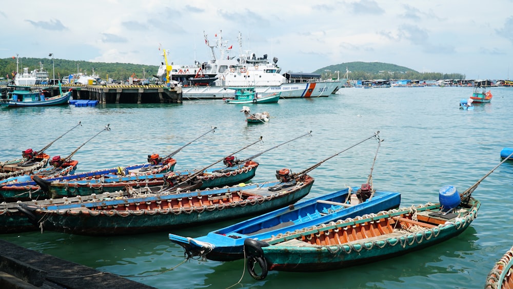 a group of boats that are sitting in the water