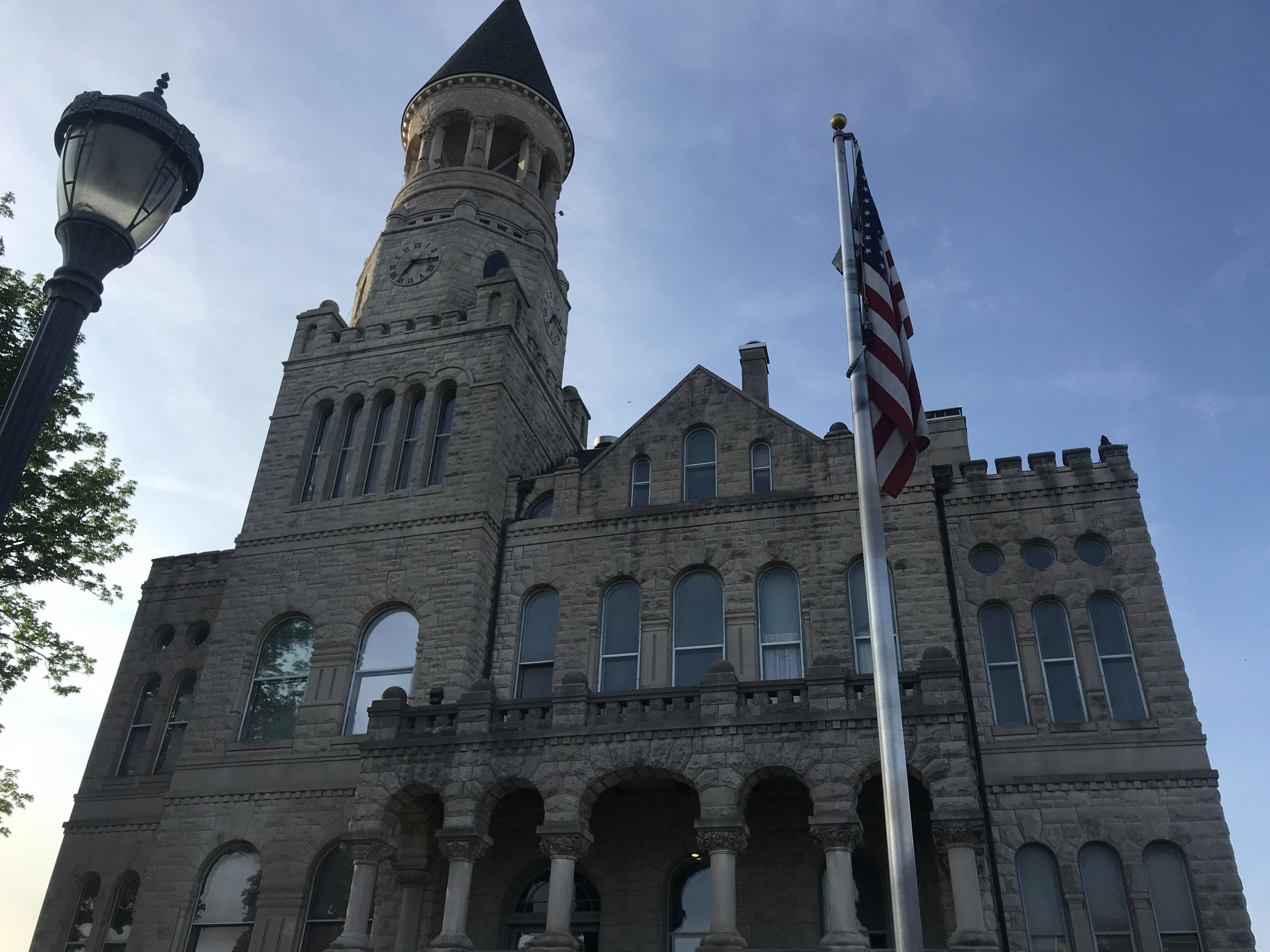 a tall building with a clock on the front of it