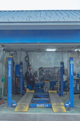 a garage filled with lots of tools and equipment