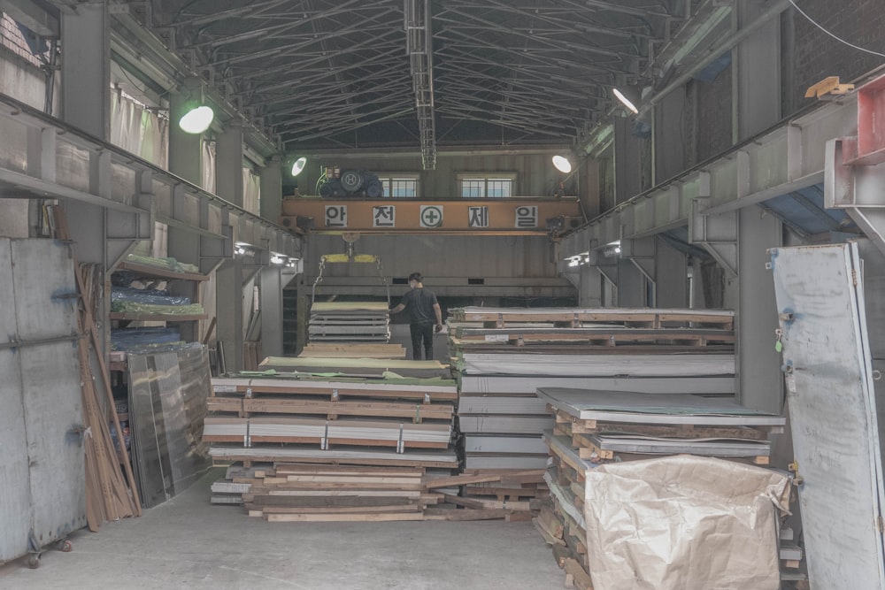 a warehouse filled with lots of wooden pallets