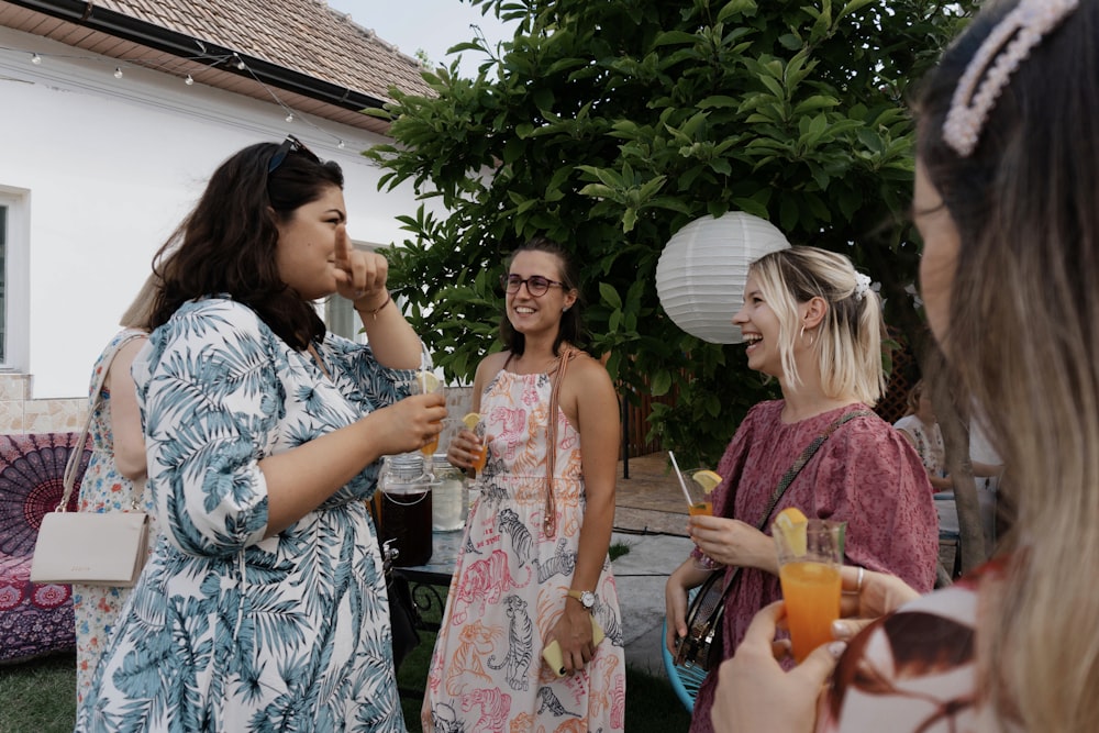 a group of women standing next to each other