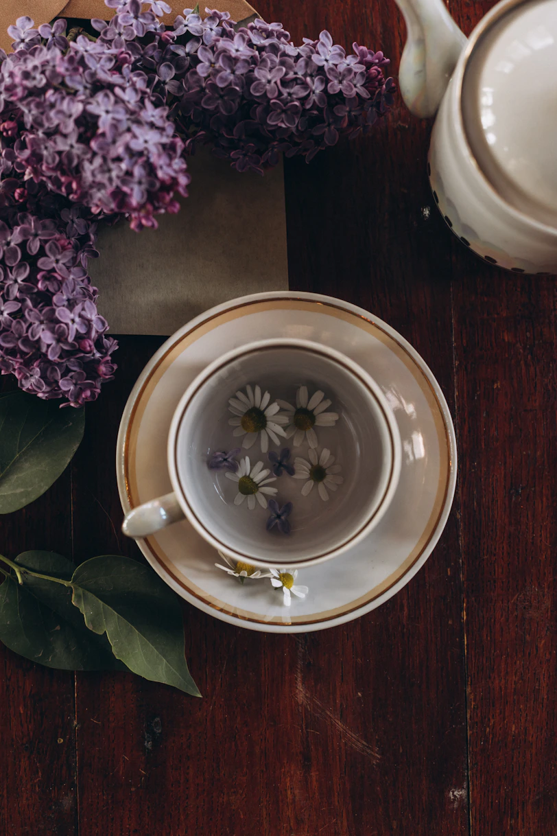 a cup of tea sitting on top of a wooden table