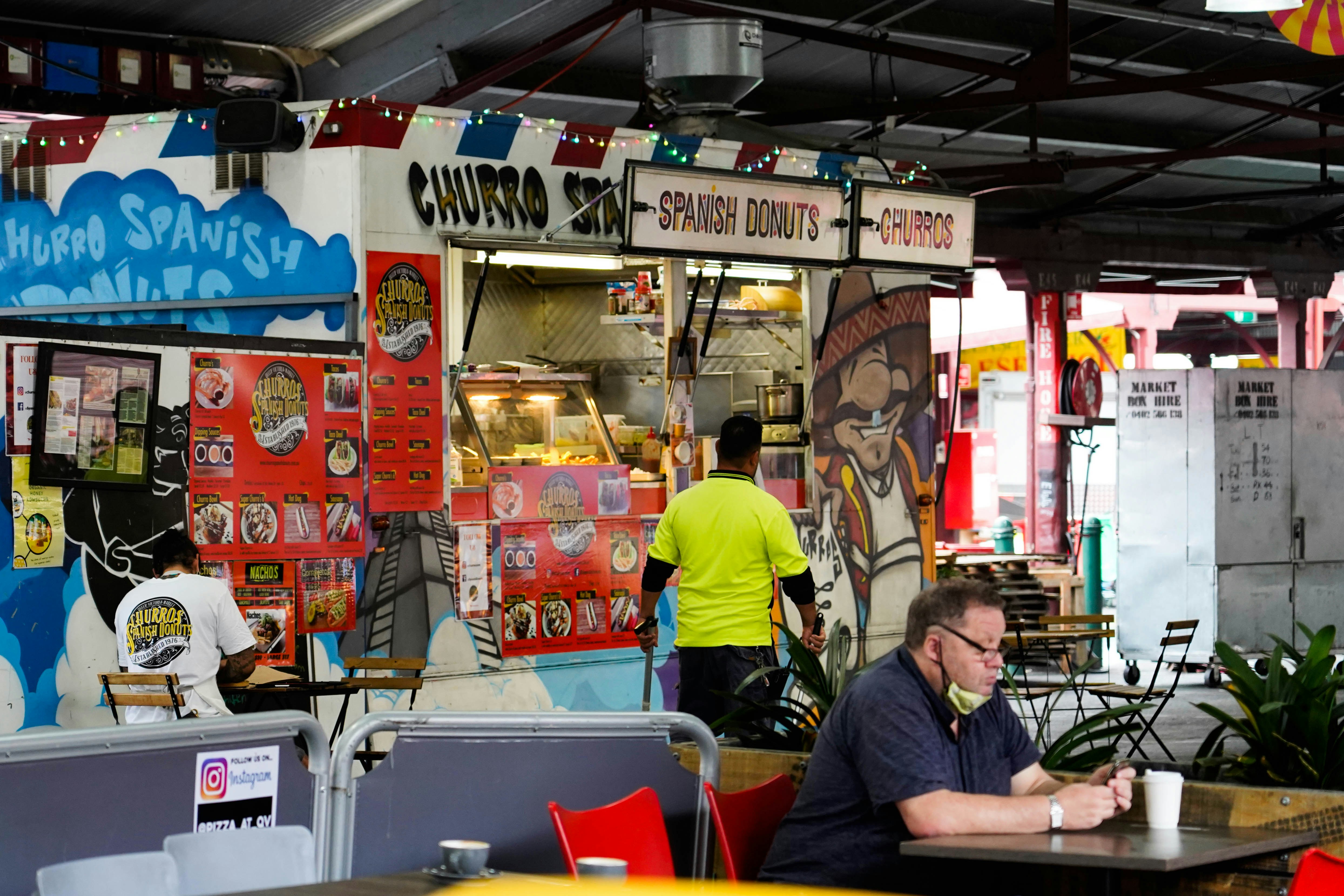 a man sitting at a table in a restaurant