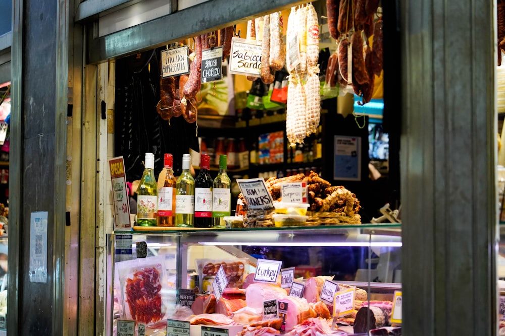 a display case in a store filled with lots of meat