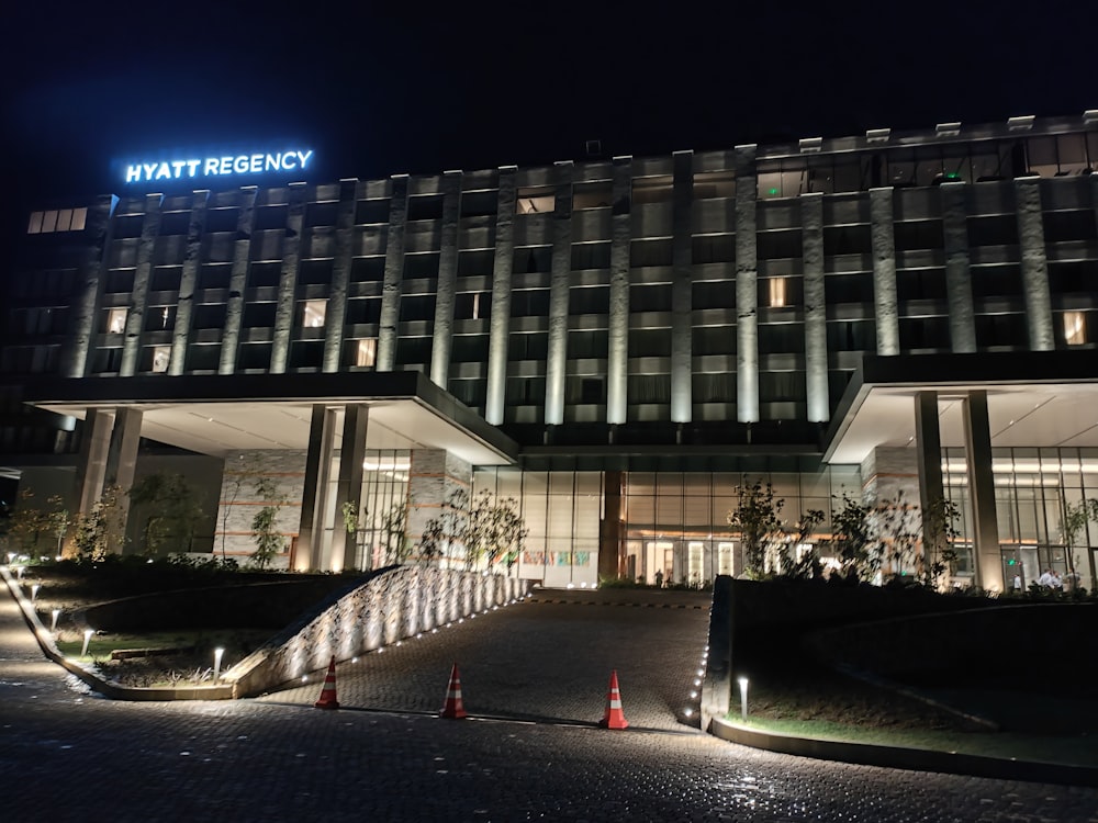 a large building lit up at night with lights on