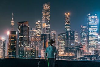 a man standing on top of a roof with a scooter