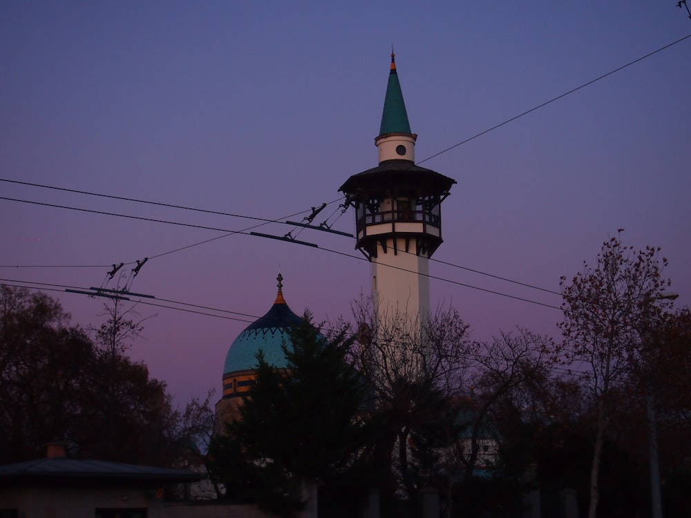 a tall tower with a clock on the top of it