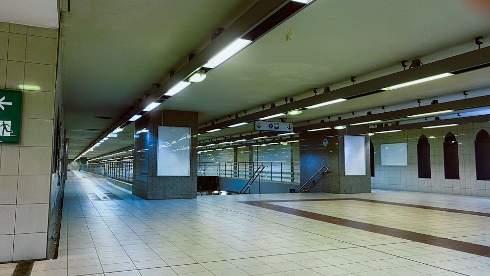 a subway station with tiled floor and walls