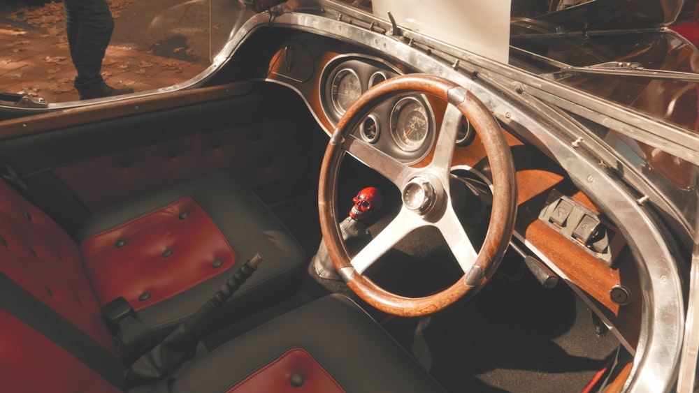 the interior of a car with a steering wheel and dashboard