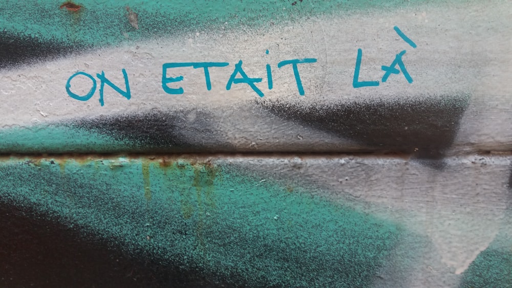 graffiti on a wall that says on etait la