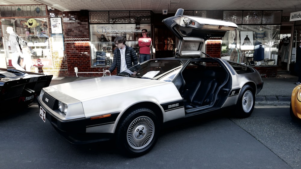 a back to the future car parked in front of a store