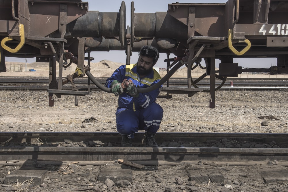 a man working on a rail road track
