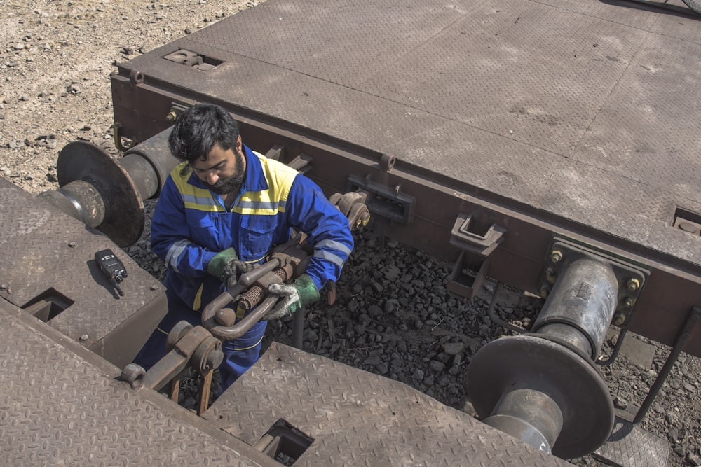 a man working on a piece of machinery