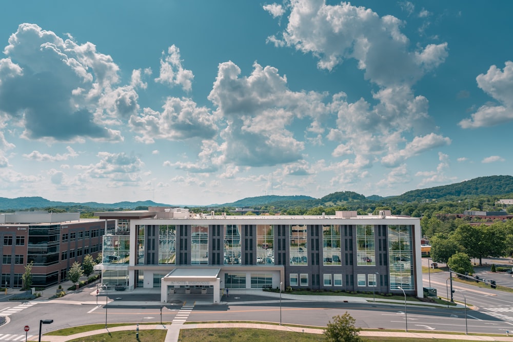 an aerial view of a building with a parking lot