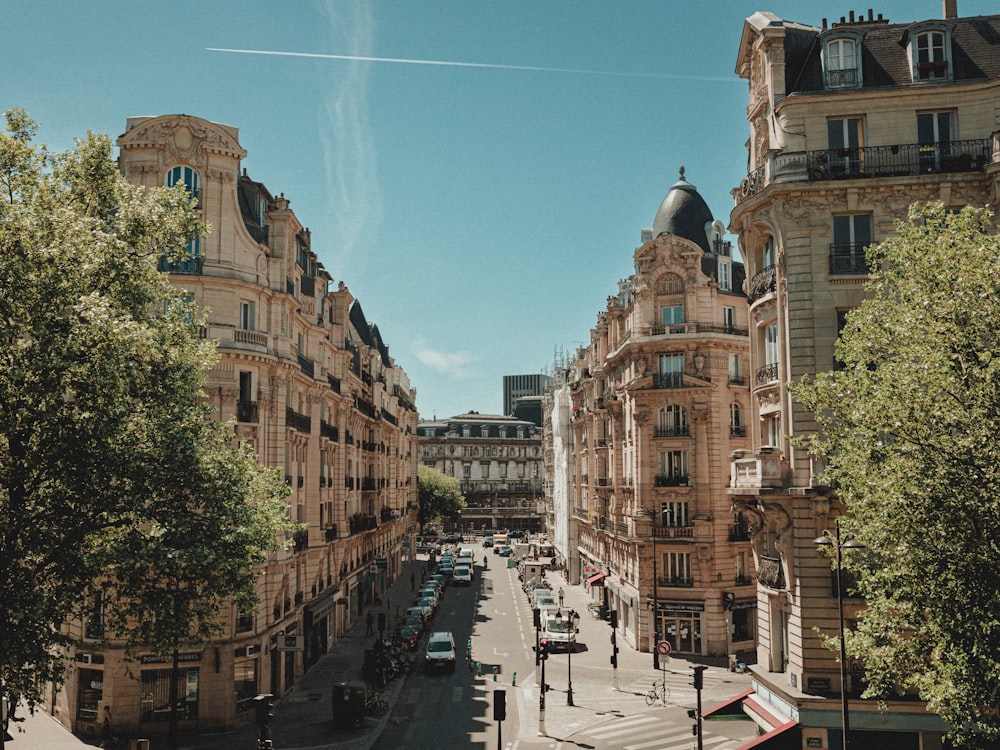 a city street filled with lots of tall buildings