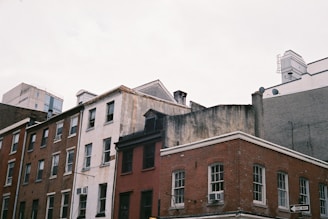 a row of buildings with a traffic light in front of them