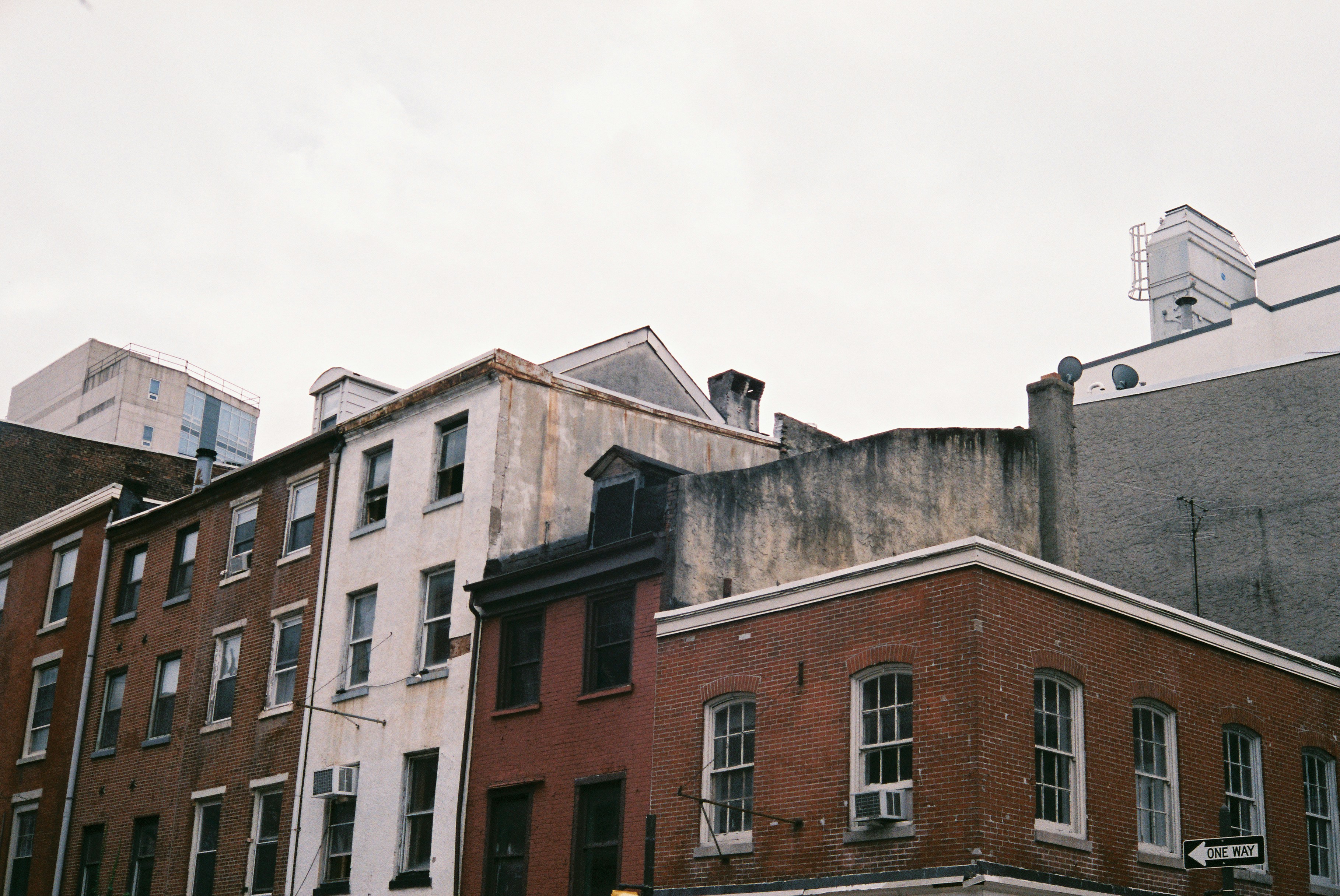 a row of buildings with a traffic light in front of them