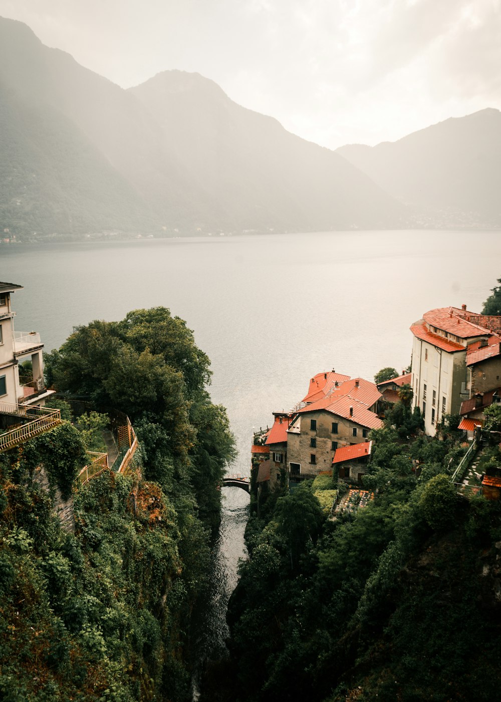 a scenic view of a village on the edge of a cliff