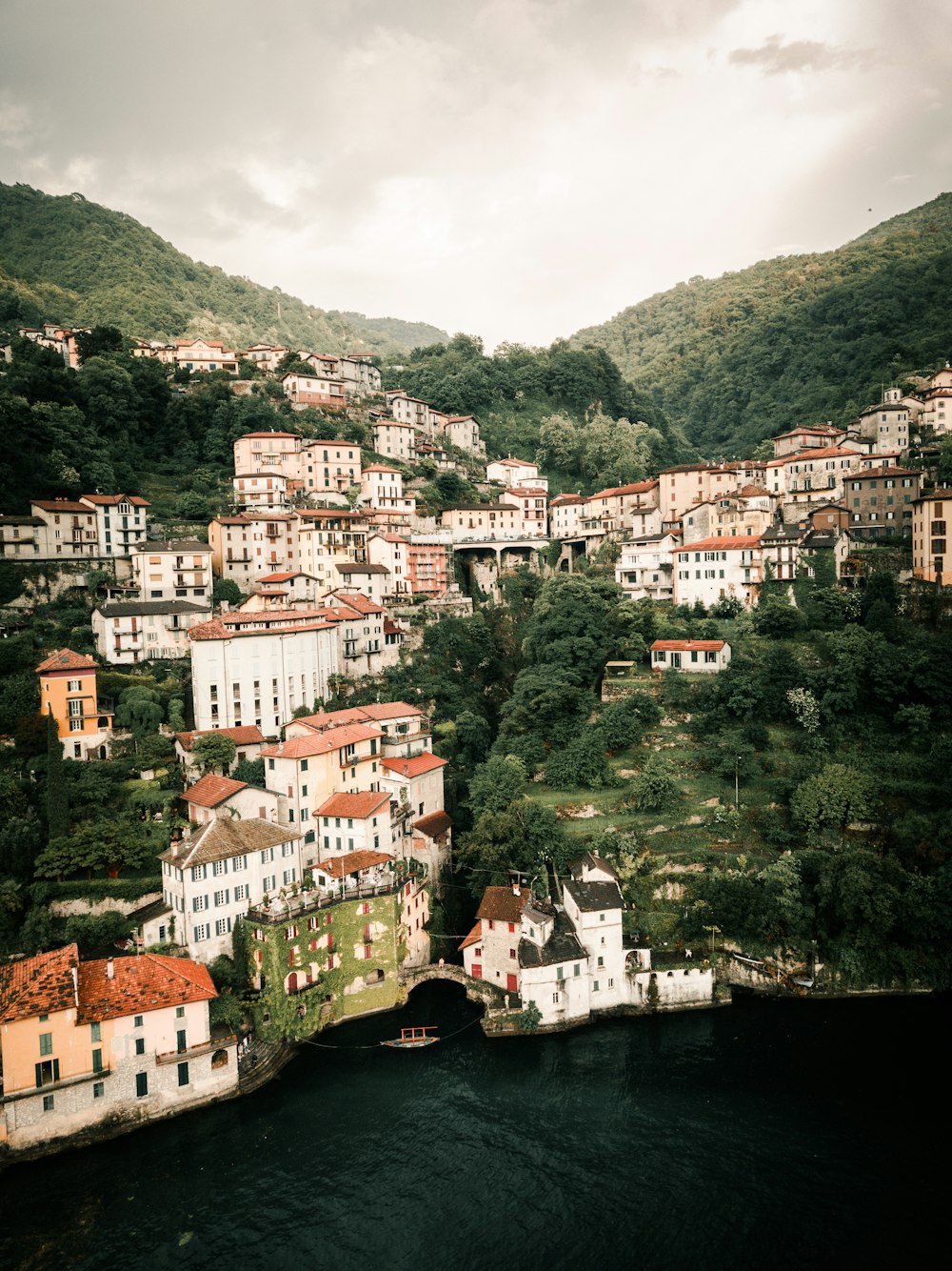 a river running through a lush green hillside