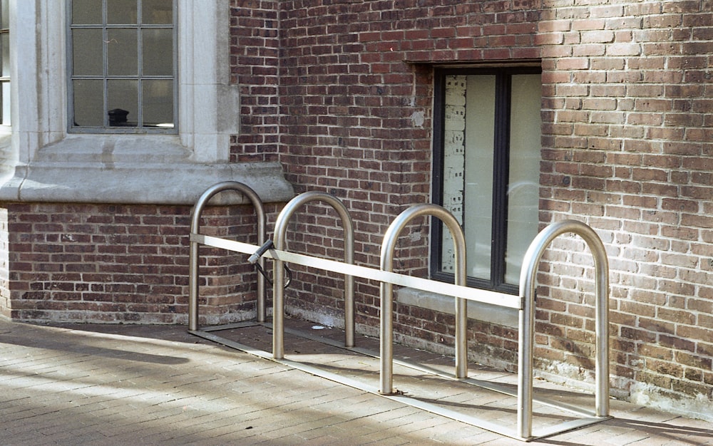 a brick building with a metal railing in front of it