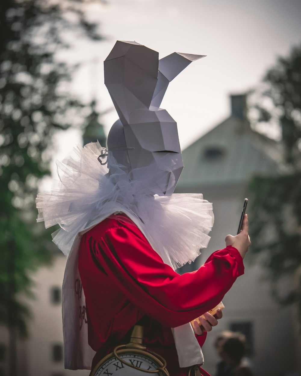 a person in a costume holding a cell phone