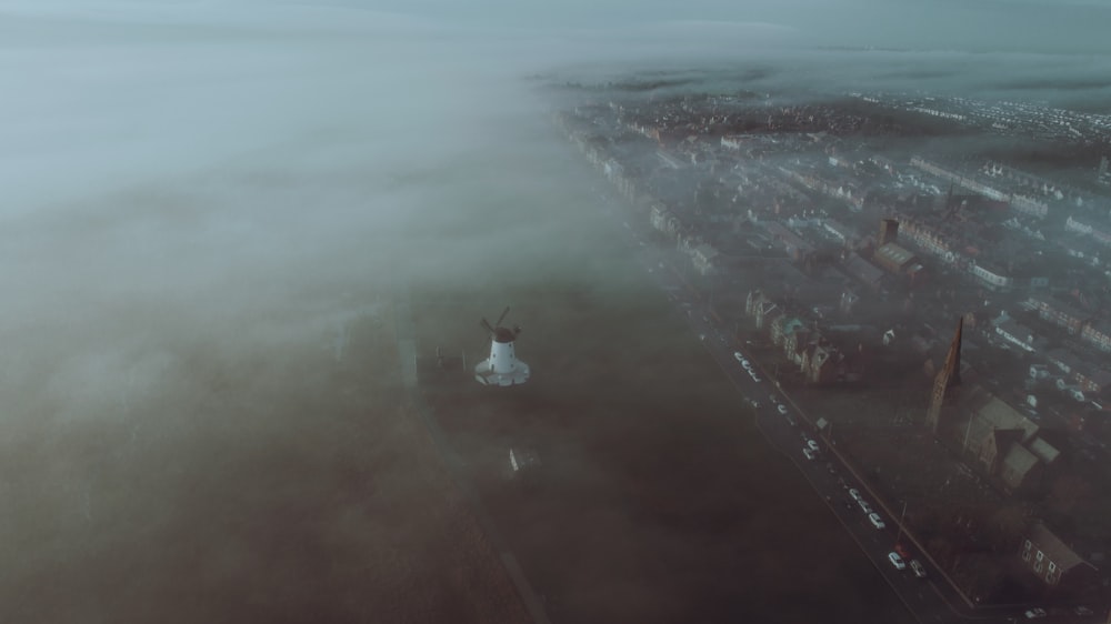 an aerial view of a city in the fog