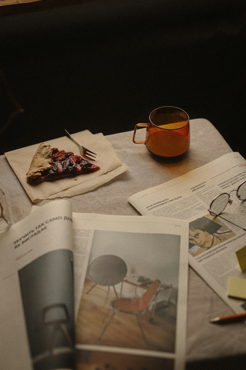 a table topped with a cup of tea and a plate of food