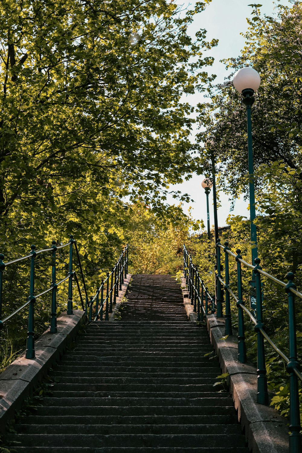 a set of stairs leading up to a light pole