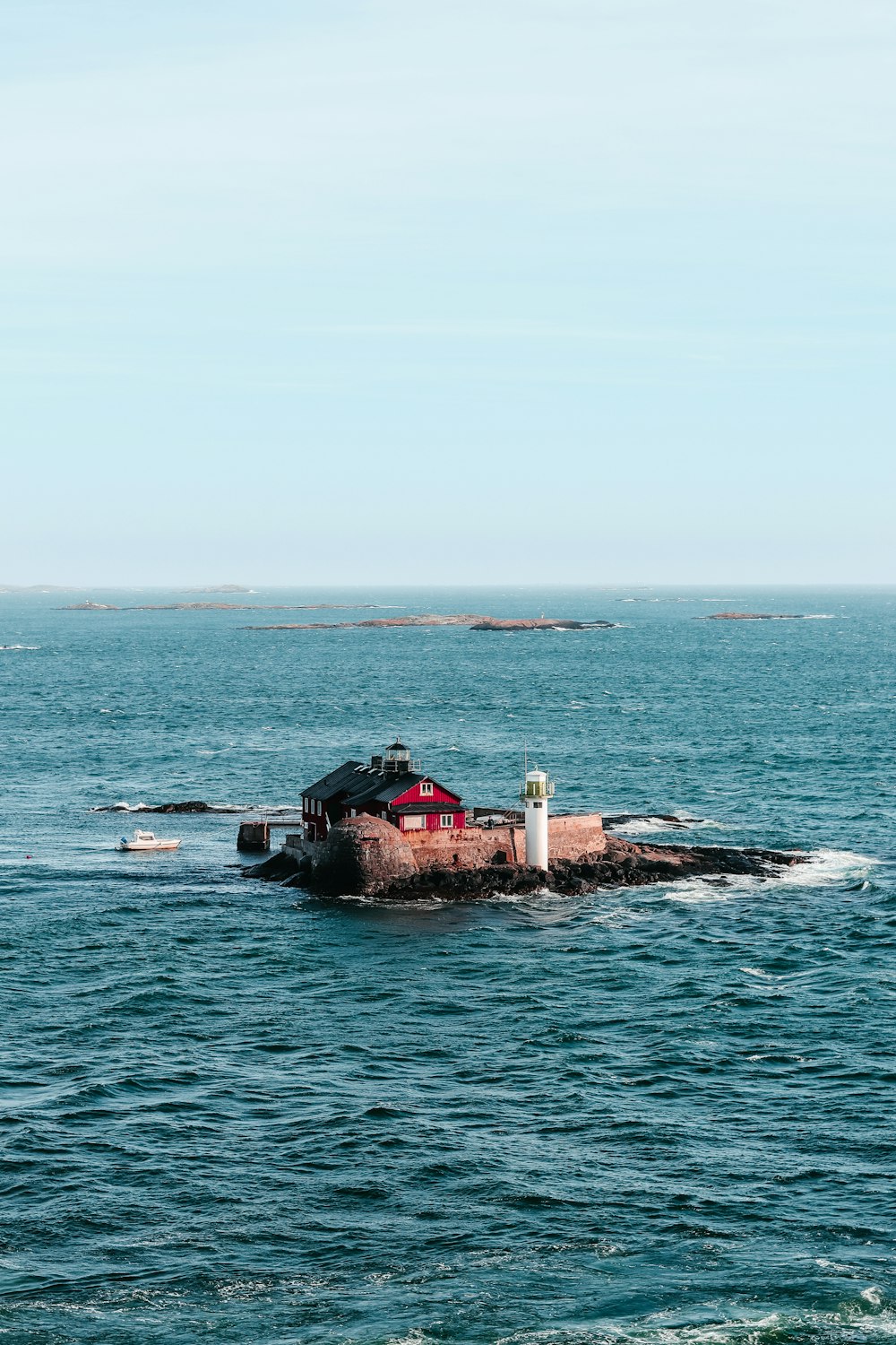 a small boat traveling across a large body of water