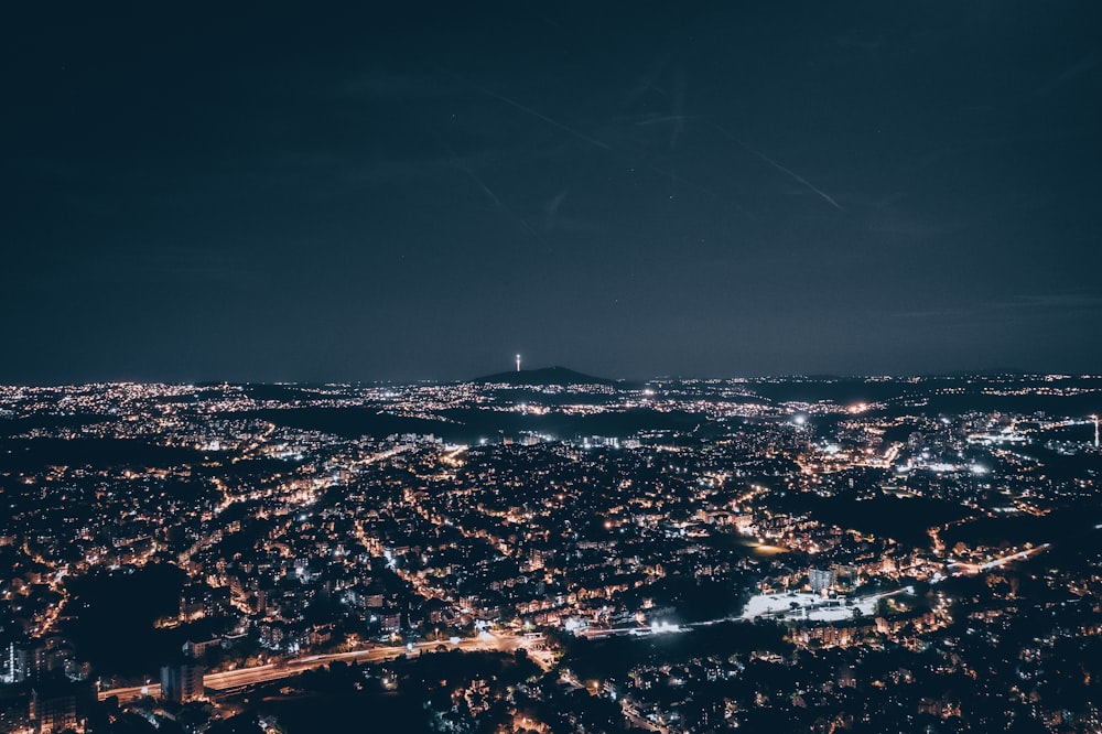 a view of a city at night from an airplane