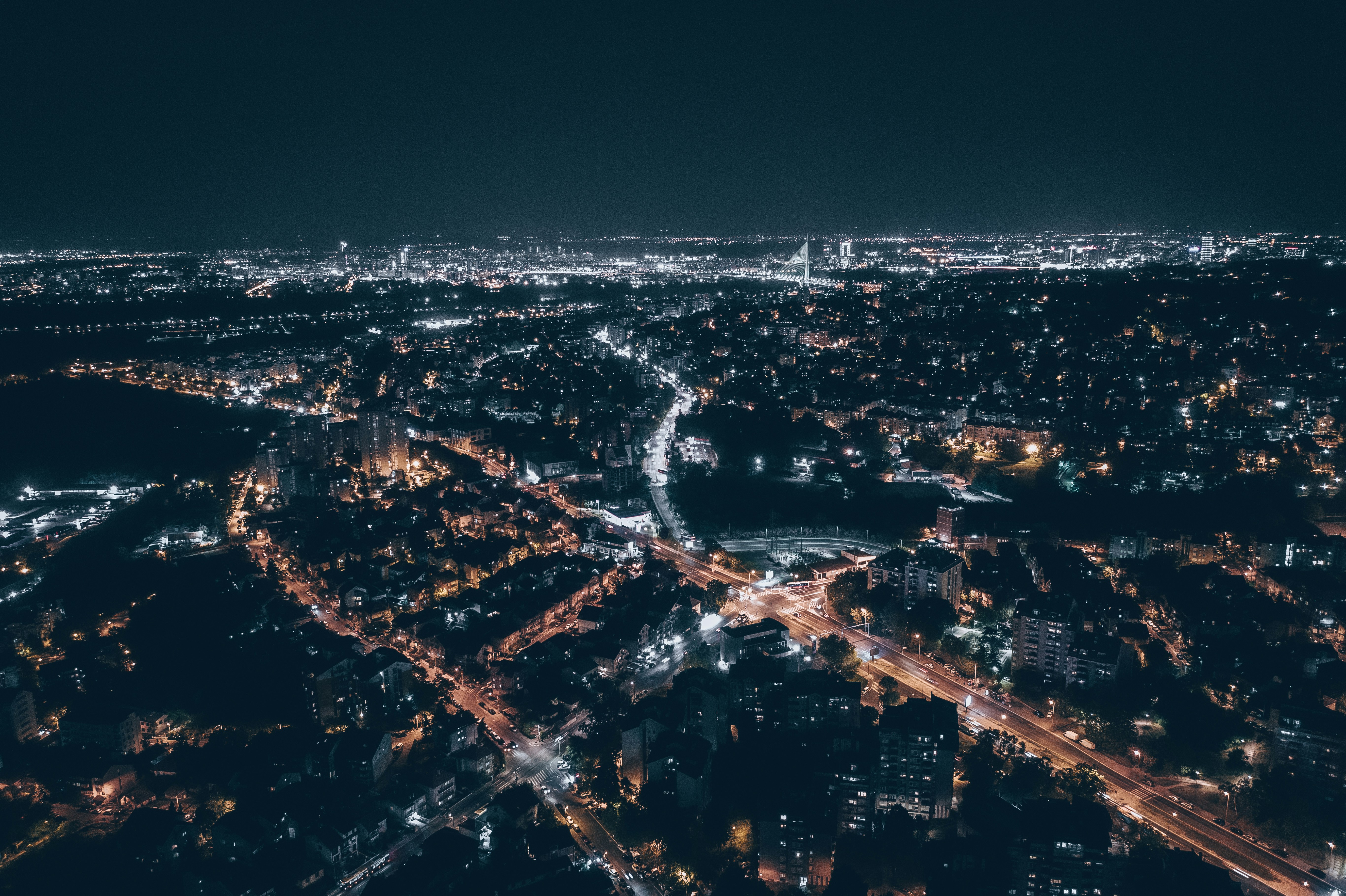 city with high rise buildings during night time 