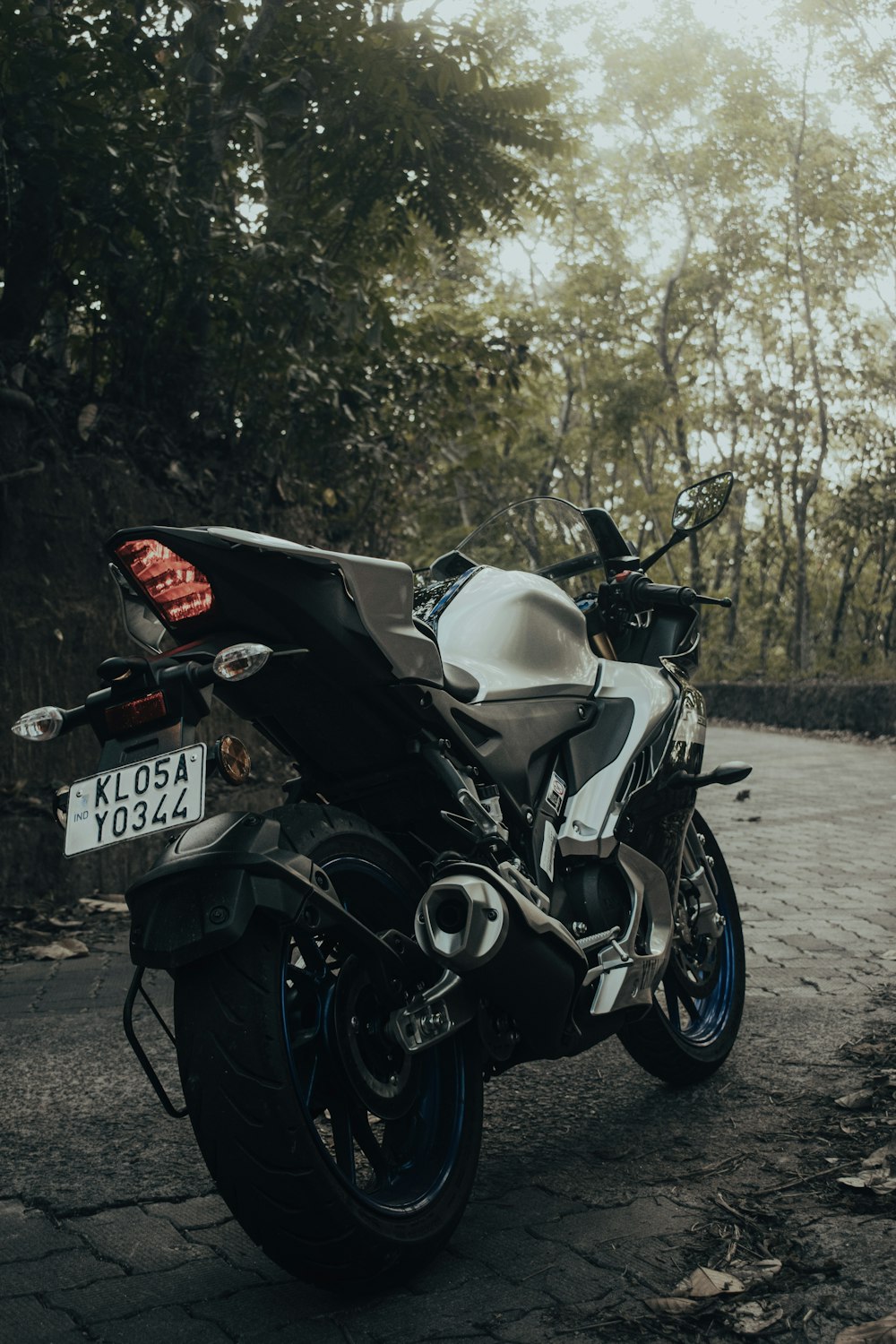 a motorcycle parked on the side of a road